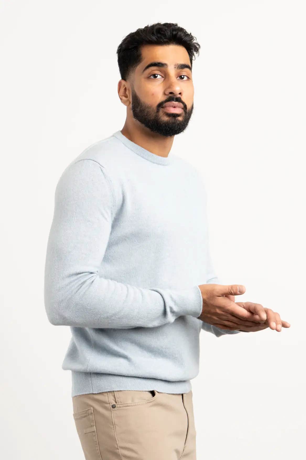 Light Blue Oasi Cashmere Crewneck sweater worn by an Indian man against a white background