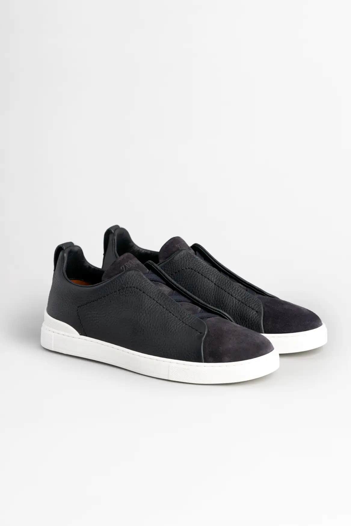 ZEGNA Navy grained leather and sued triple stitch sneakers on a white background